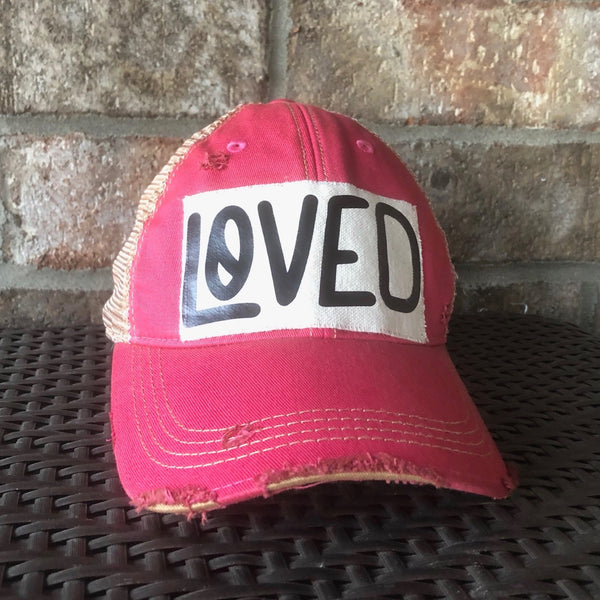 Loved hat by BohoGroove with black Loved lettering on a leopard vintage distressed snapback trucker hat.