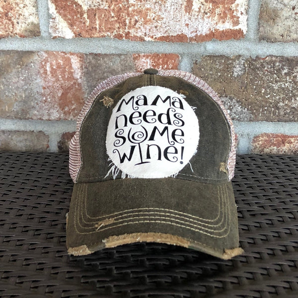 Mama Needs Some Wine hat by BohoGroove with black Mama Needs Some Wine lettering on a distressed off-white patch on a black vintage distressed snapback trucker hat.