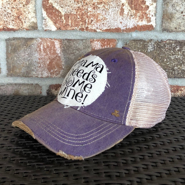 Right side view of Mama Needs Some Wine hat by BohoGroove featuring whimsical black script lettering on a distressed off-white patch on a purple vintage distressed snapback trucker hat.