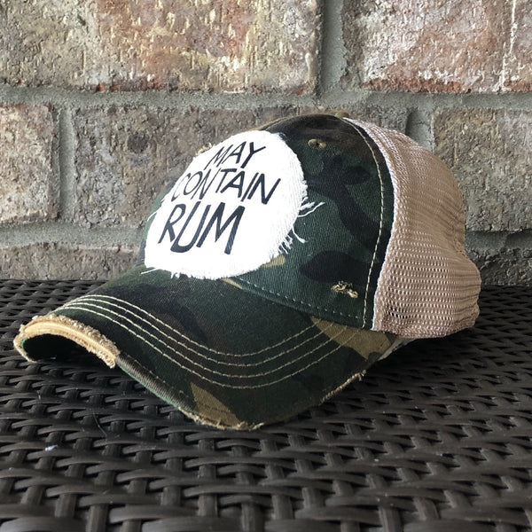 May Contain Rum hat by BohoGroove featuring distressed off-white patch with black writing on a camo vintage distressed snapback right side