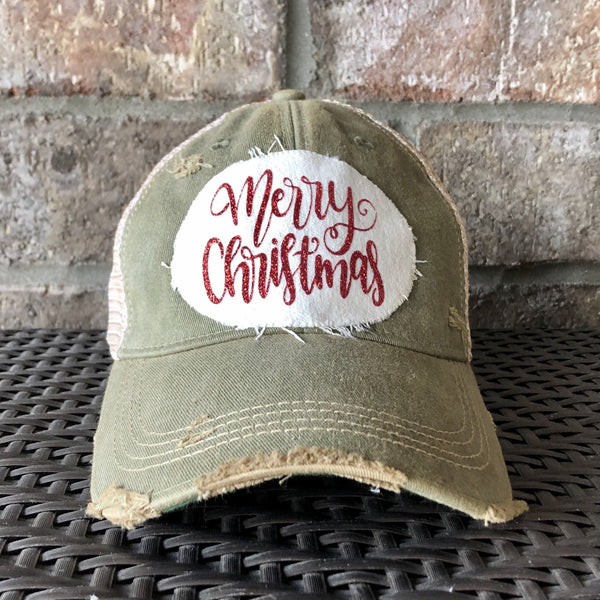 Merry Christmas Glitter hat by BohoGroove with red glitter Merry Christmas script lettering on a distressed off-white custom patch on an olive vintage distressed snapback.