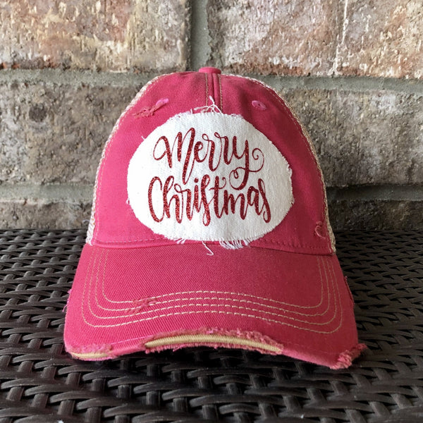 Merry Christmas Glitter hat by BohoGroove with red glitter Merry Christmas script lettering on a distressed off-white custom patch on a pink vintage distressed snapback.