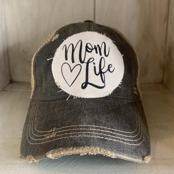 Mom Life hat by BohoGroove with black Mom Life lettering and heart graphic on a distressed off-white patch on a black vintage distressed snapback.