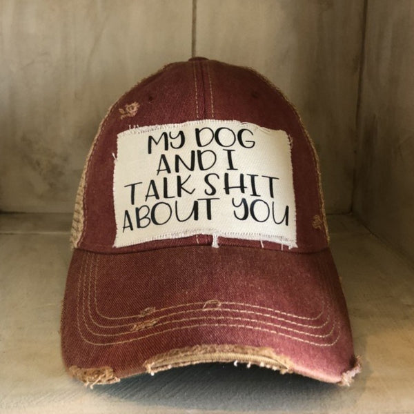 My Dog and I Talk Shit About You hat by BohoGroove with black My Dog and I Talk Shit About You lettering on a distressed off-white patch on a brick red vintage distressed snapback.