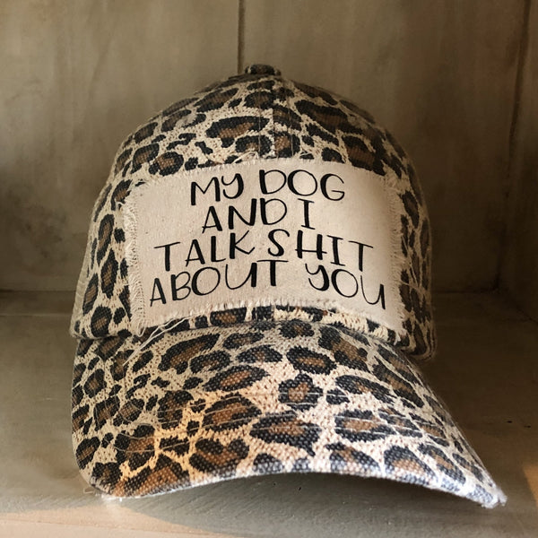 My Dog and I Talk Shit About You hat by BohoGroove with black My Dog and I Talk Shit About You lettering on a distressed off-white patch on a leopard vintage distressed snapback.