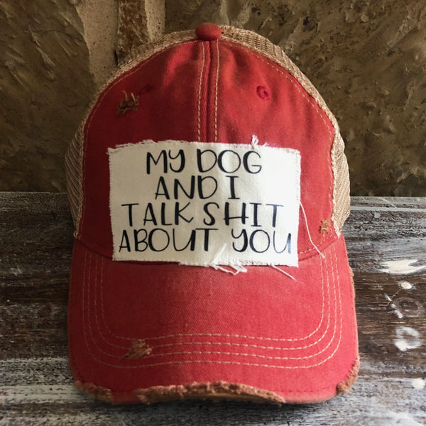 My Dog and I Talk Shit About You hat by BohoGroove with black My Dog and I Talk Shit About You lettering on a distressed off-white patch on a red vintage distressed snapback.