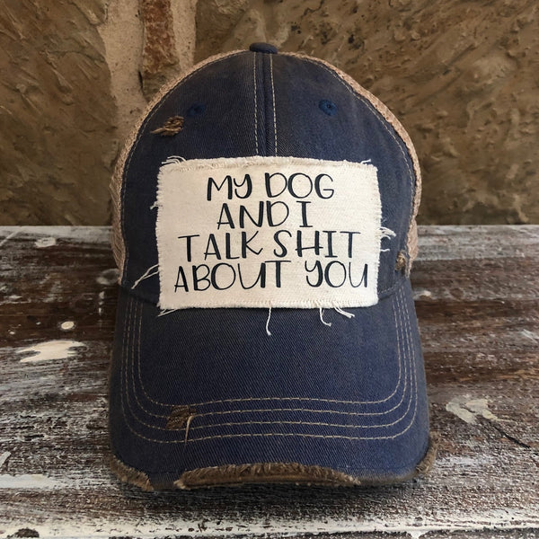 My Dog and I Talk Shit About You hat by BohoGroove with black My Dog and I Talk Shit About You lettering on a distressed off-white patch on a royal blue vintage distressed snapback.