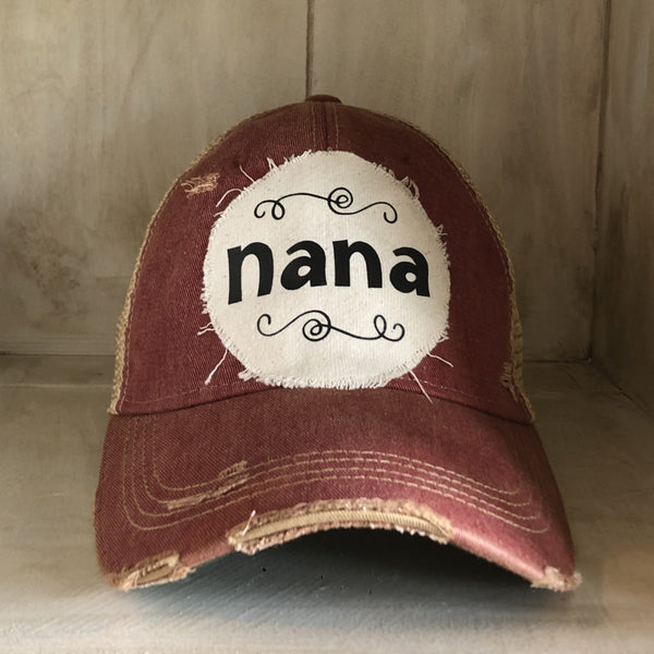 Nana hat by BohoGroove with black Nana lettering on distressed off-white patch on a brick red vintage distressed snapback.