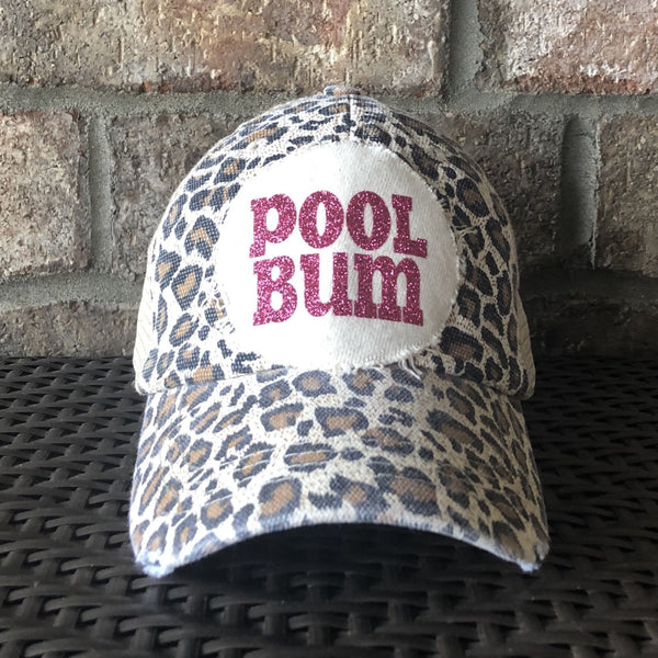 Pool Bum hat by BohoGroove featuring distressed off-white patch with pink glitter Pool Bum lettering on a leopard vintage distressed snapback