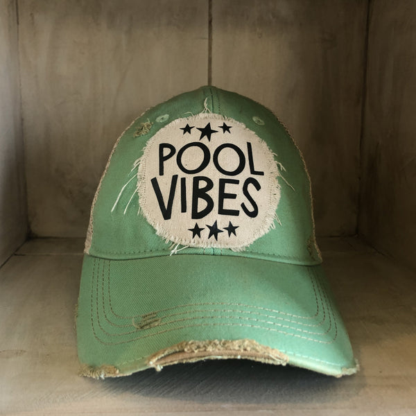 Pool Vibes hat by BohoGroove featuring distressed off-white patch with Pool Vibes lettering and black stars on a mint vintage distressed snapback