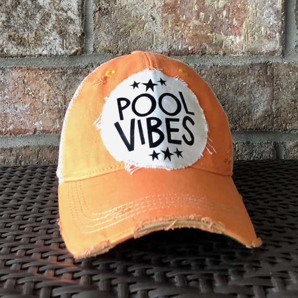 Pool Vibes hat by BohoGroove featuring distressed off-white patch with Pool Vibes lettering and black stars on a sherbet vintage distressed snapback