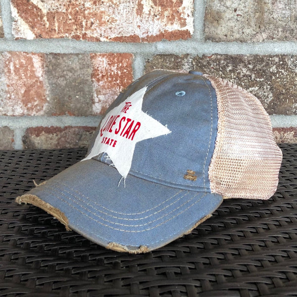 Right side view Lone Star State hat by BohoGroove with red Lone Star State lettering on white star-shaped patch and light blue vintage distressed snapback