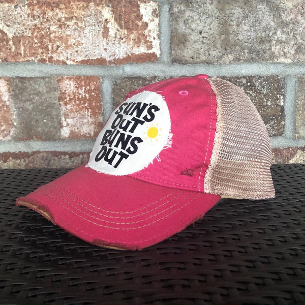 Suns Out Buns Out hat by BohoGroove with black lettering and yellow sun graphic on distressed off-white patch on pink vintage distressed snapback.