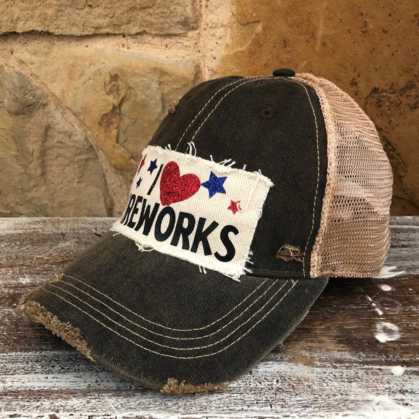 I Love Fireworks hat by BohoGroove with black lettering, red glitter heart, and red and blue stars on distressed off-white patch and black vintage distressed snapback
