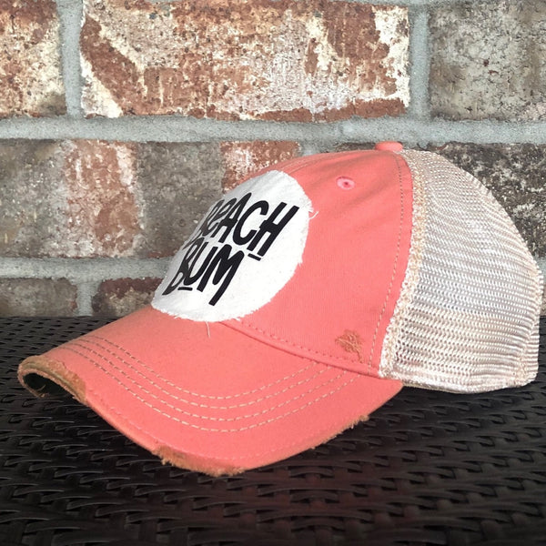 Beach Bum hat by BohoGroove with black Beach Bum lettering on distressed off-white patch on a sherbet vintage distressed snapback.