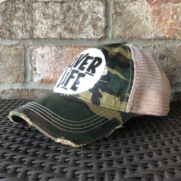 River Life hat by BohoGroove featuring distressed off-white patch with River Life lettering on a camo vintage distressed snapback right side