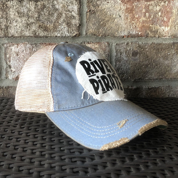 River Pirate hat by BohoGroove featuring distressed off-white patch with black River Pirate lettering on a light blue vintage distressed snapback left side