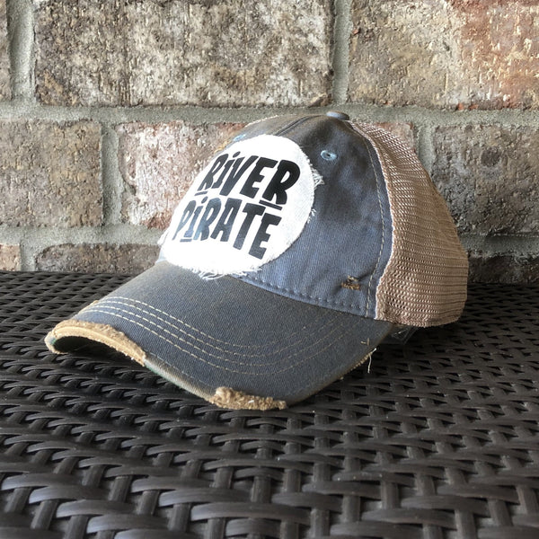 River Pirate hat by BohoGroove featuring distressed off-white patch with black River Pirate lettering on a light blue vintage distressed snapback right side