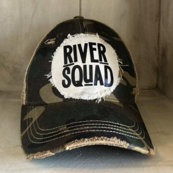 River Squad hat by BohoGroove featuring distressed off-white patch with black River Squad lettering on a camo vintage distressed snapback
