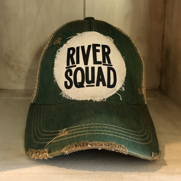River Squad hat by BohoGroove featuring distressed off-white patch with black River Squad lettering on a green vintage distressed snapback