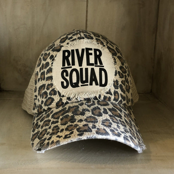 River Squad hat by BohoGroove featuring distressed off-white patch with black River Squad lettering on a leopard vintage distressed snapback