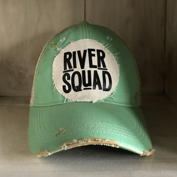 River Squad hat by BohoGroove featuring distressed off-white patch with black River Squad lettering on a mint vintage distressed snapback