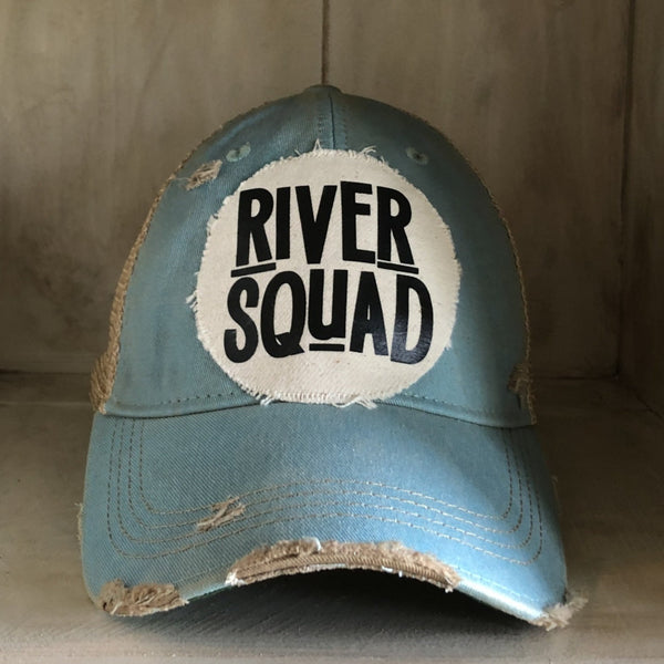 River Squad hat by BohoGroove featuring distressed off-white patch with black River Squad lettering on an ocean blue vintage distressed snapback