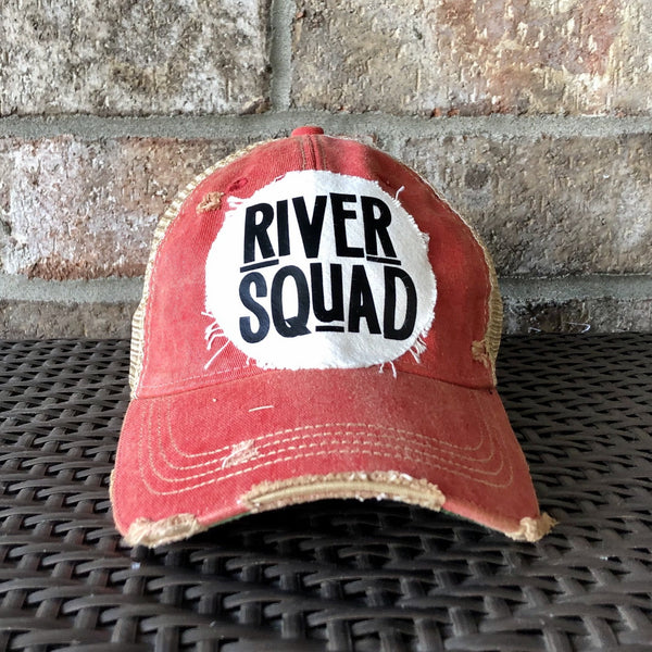 River Squad hat by BohoGroove featuring distressed off-white patch with black River Squad lettering on a red vintage distressed snapback