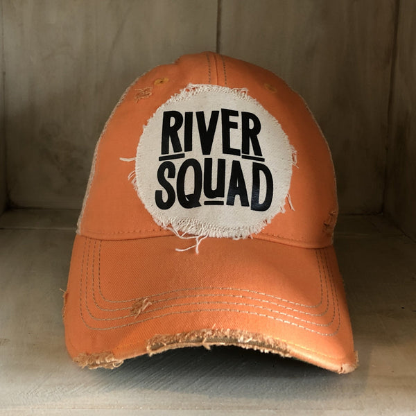 River Squad hat by BohoGroove featuring distressed off-white patch with black River Squad lettering on a sherbet vintage distressed snapback