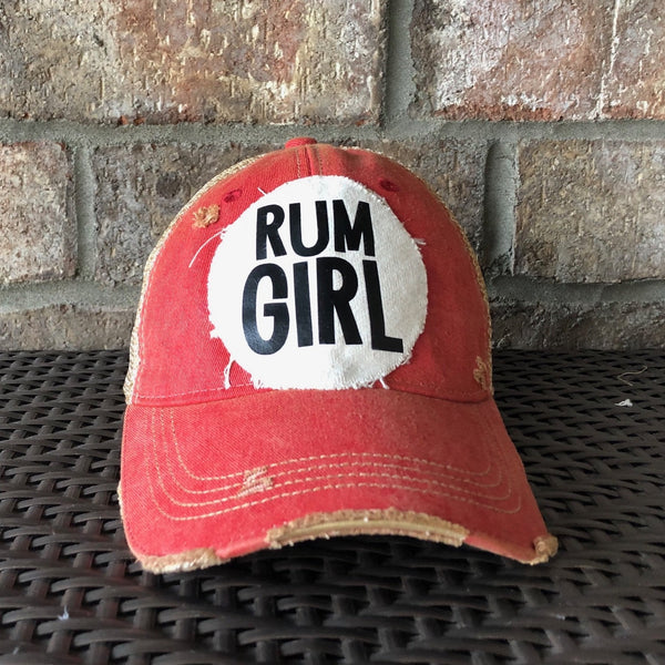 Rum Girl hat by BohoGroove with bold black Rum Girl lettering on a distressed off-white patch on a red vintage distressed snapback trucker hat.