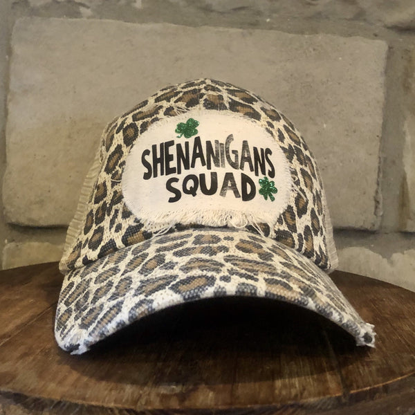 Shenanigans Squad hat by BohoGroove with green lettering and shamrock graphics on a distressed off-white custom patch on a leopard vintage distressed snapback.