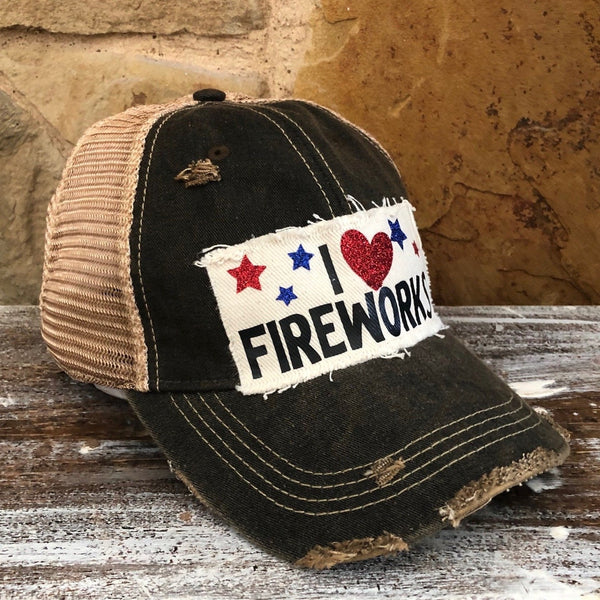 I Love Fireworks hat by BohoGroove with black lettering, red glitter heart, and red and blue stars on distressed off-white patch and black vintage distressed snapback