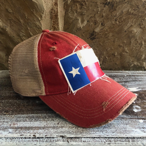 Side view of Texas Flag hat by BohoGroove featuring Texas flag patch on red vintage distressed snapback