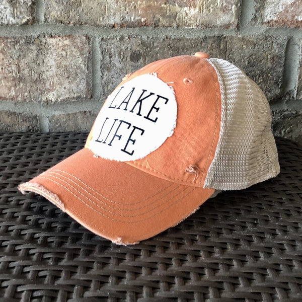 Lake Life hat by BohoGroove with black Lake Life lettering on distressed off-white patch on a sherbet vintage distressed snapback.