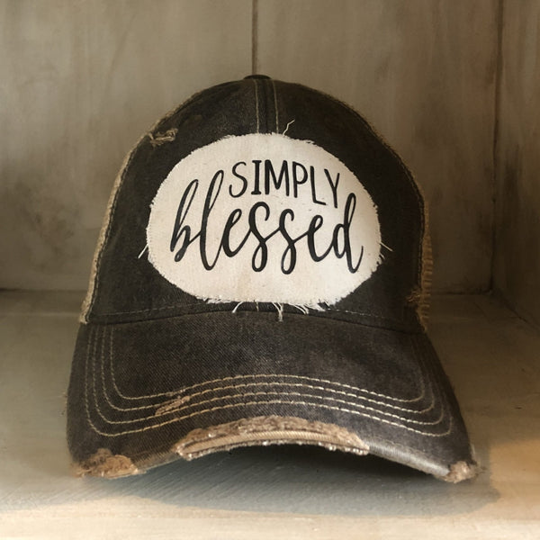 Simply Blessed hat by BohoGroove with black Simply Blessed lettering on a distressed off-white patch on a black vintage distressed snapback.