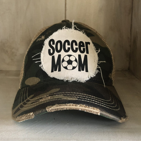 Soccer Mom hat by BohoGroove featuring black Soccer Mom lettering on a camo vintage distressed snapback hat