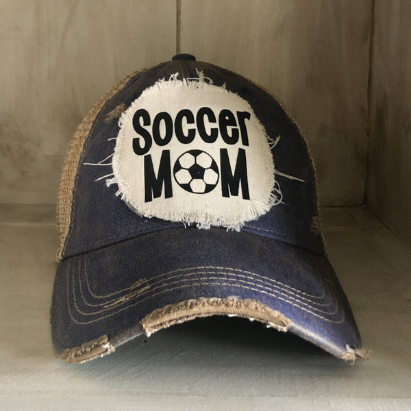 Soccer Mom hat by BohoGroove featuring black Soccer Mom lettering on a navy blue vintage distressed snapback hat