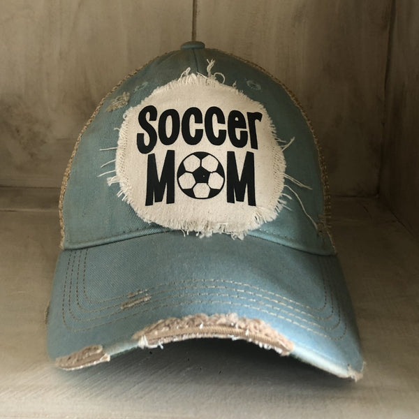 Soccer Mom hat by BohoGroove featuring black Soccer Mom lettering on an ocean blue vintage distressed snapback hat