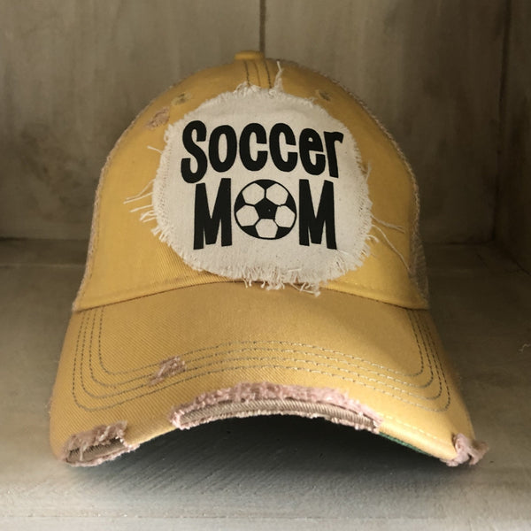 Soccer Mom hat by BohoGroove featuring black Soccer Mom lettering on a yellow vintage distressed snapback hat