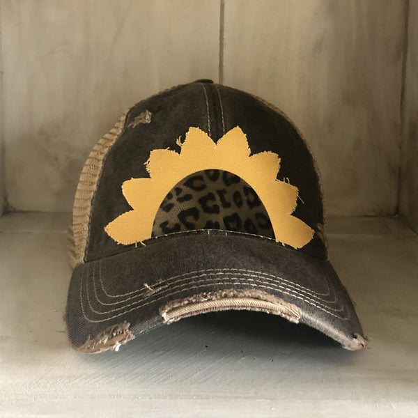 Sunflower hat by BohoGroove featuring yellow sunflower petals and a leopard center on a black vintage distressed snapback.