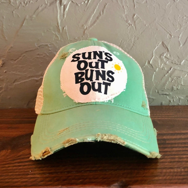 Suns Out Buns Out hat by BohoGroove with black lettering and yellow sun graphic on distressed off-white patch on mint vintage distressed snapback.