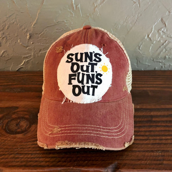 Sun's Out Fun's Out hat by BohoGroove with black Sun's Out Fun's Out lettering and yellow sun graphic on distressed off-white patch on a brick red vintage distressed snapback.