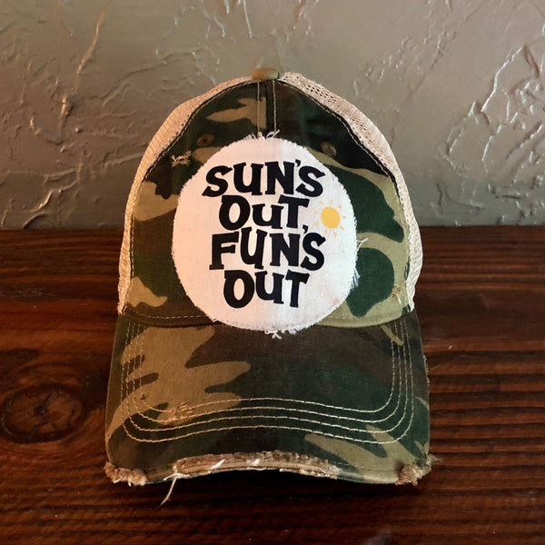 Sun's Out Fun's Out hat by BohoGroove with black Sun's Out Fun's Out lettering and yellow sun graphic on distressed off-white patch on a camo vintage distressed snapback.