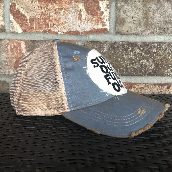 Sun's Out Fun's Out hat by BohoGroove with black Sun's Out Fun's Out lettering and yellow sun graphic on distressed off-white patch on a light blue vintage distressed snapback.