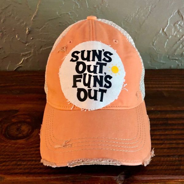 Sun's Out Fun's Out hat by BohoGroove with black Sun's Out Fun's Out lettering and yellow sun graphic on distressed off-white patch on a sherbet vintage distressed snapback.
