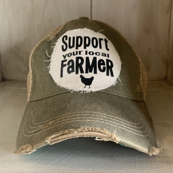 Support Your Local Farmer hat by BohoGroove with black Support Your Local Farmer lettering and chicken graphic on a distressed off-white patch on an olive vintage distressed snapback.