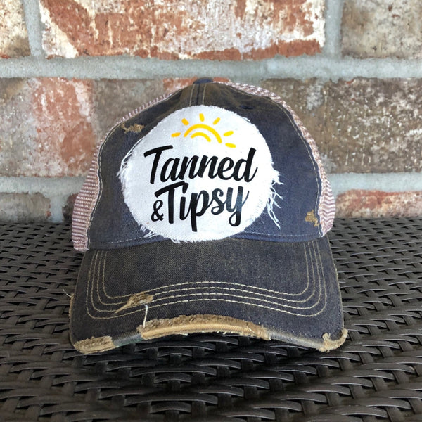 Tanned and Tipsy Hat by BohoGroove on a distressed mint snapback trucker hat with hand-applied patch design and vintage weathered style.