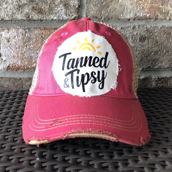 Tanned and Tipsy Hat by BohoGroove on a distressed pink snapback trucker hat with hand-applied patch design and vintage weathered style.