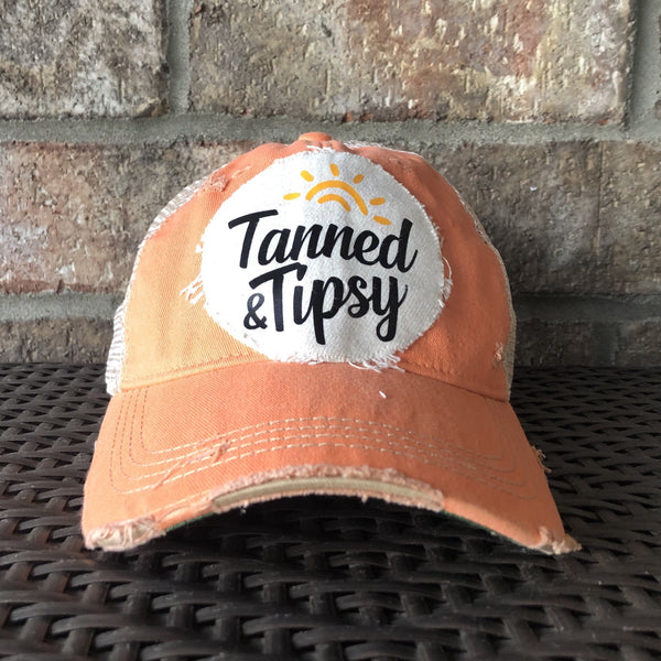 Tanned and Tipsy Hat by BohoGroove on a distressed sherbet snapback trucker hat with hand-applied patch design and vintage weathered style.