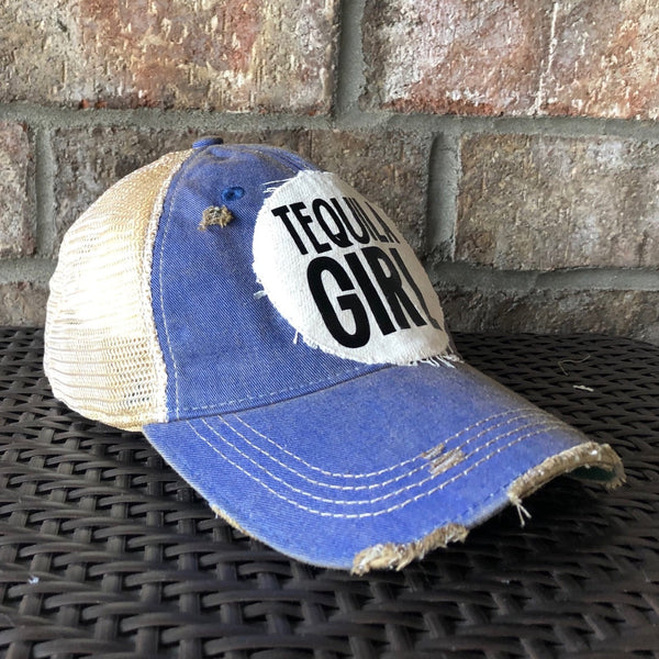 Tequila Girl hat by BohoGroove with black Tequila Girl lettering on a distressed off-white patch on a red vintage distressed snapback trucker hat.